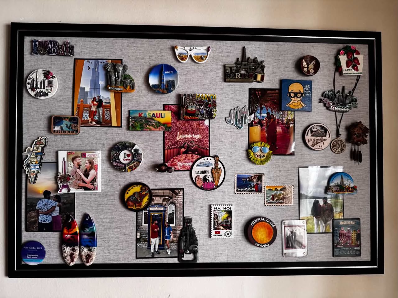 Couple vacation photos and polaroid memories on magnetic wall board