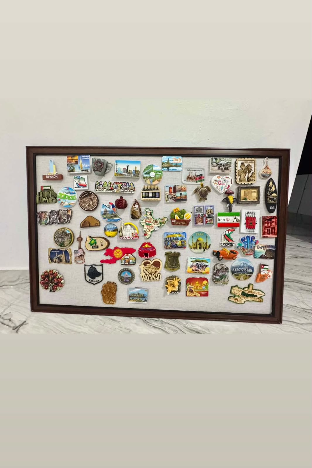 Avid traveler 50 plus country souvenir magnet collection mounted on walnut wood magnetic board